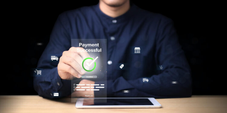 A person taps a virtual screen displaying "Payment Successful" with a green checkmark, sitting at a desk with a tablet, against a black background. Digital payment and shopping icons float around, illustrating the Procure-to-Pay Process. | Gatewit.com